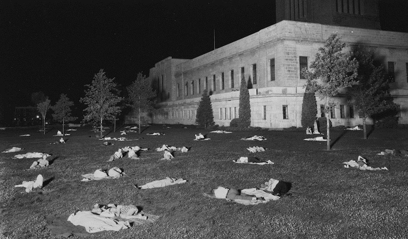 Residents of Lincoln, Nebraska spend the night on the lawn of the state capital on July 25, 1936